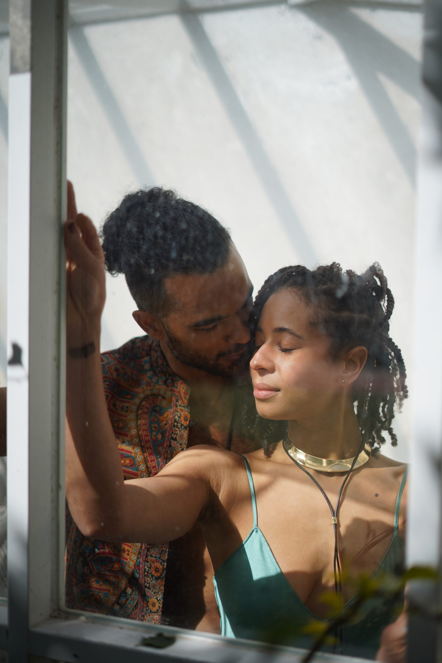 Couple being intimate on the window
