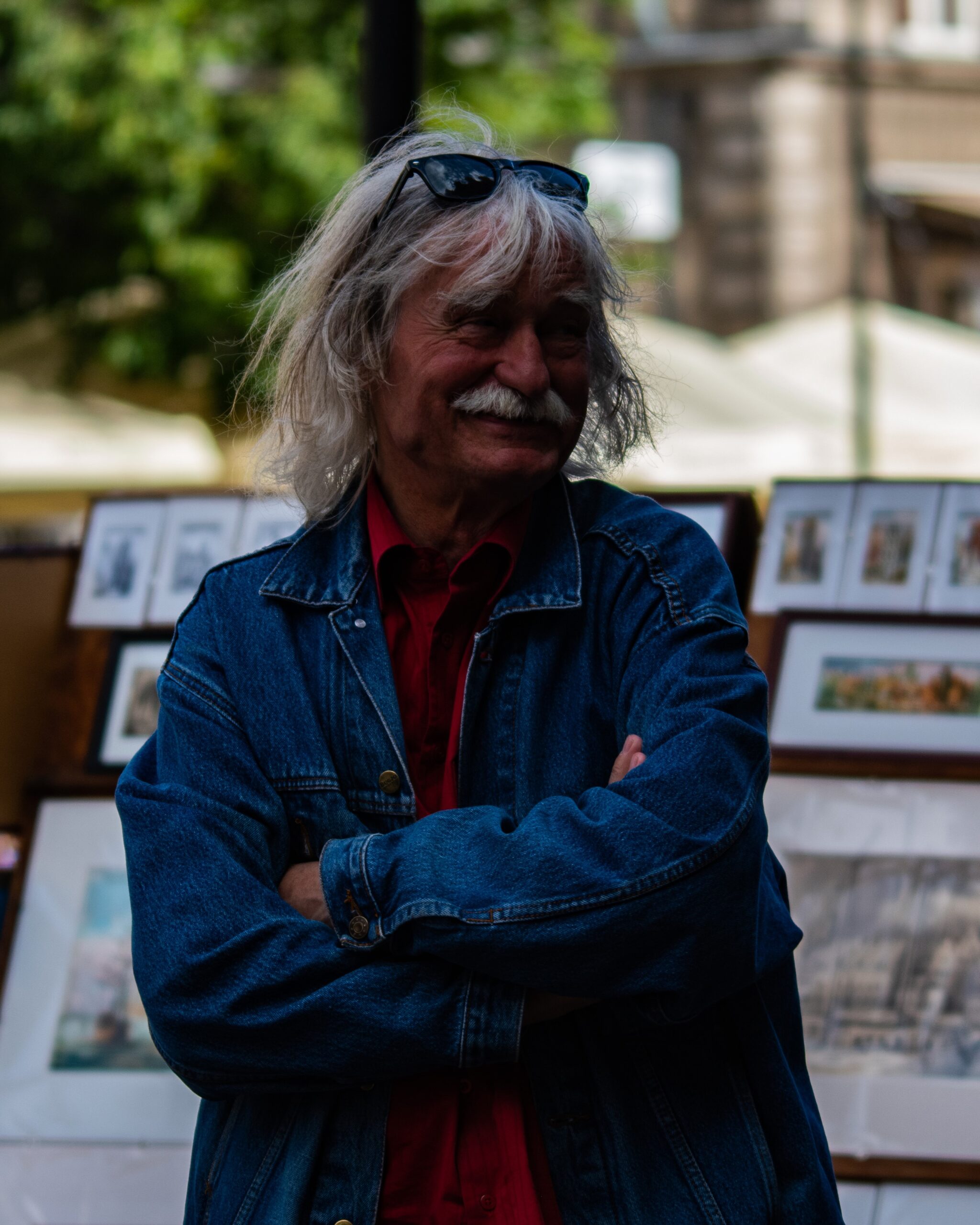 An artist in front of his art.