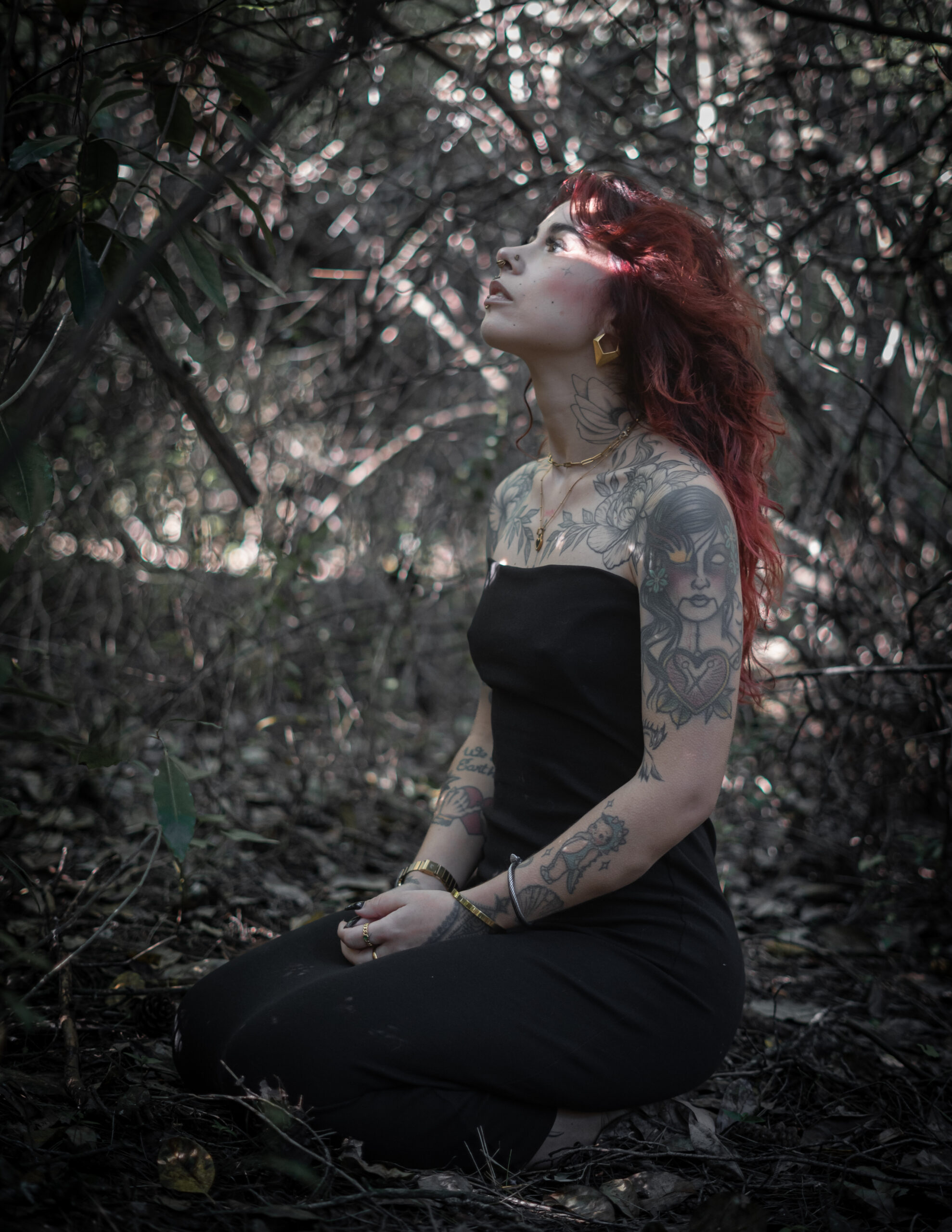 Red haired women in middle of forest
