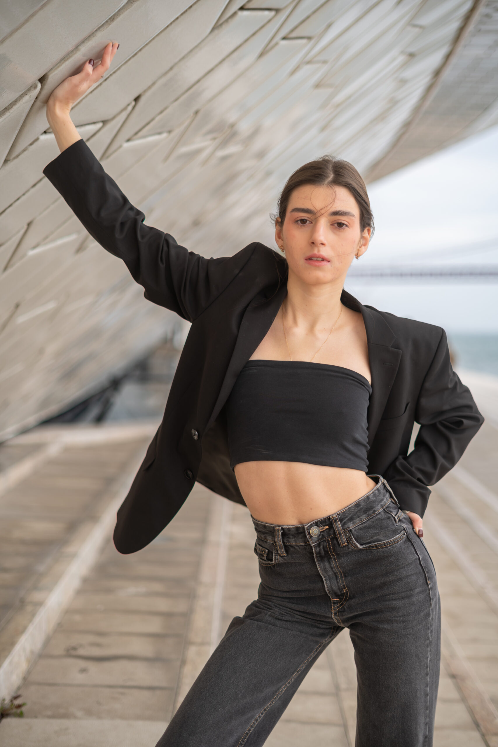 Girl standing in under a building