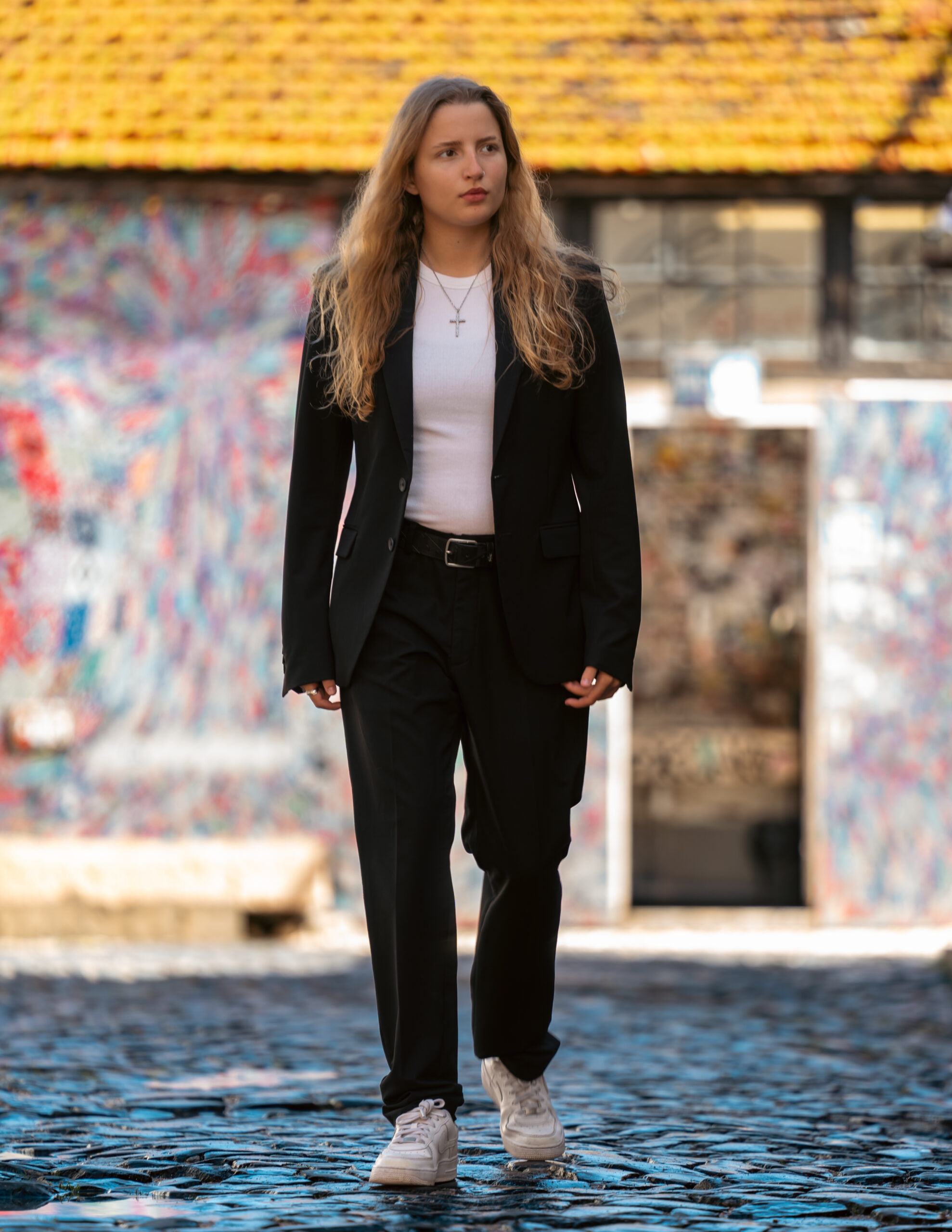 Girl in professional attire walking in the street