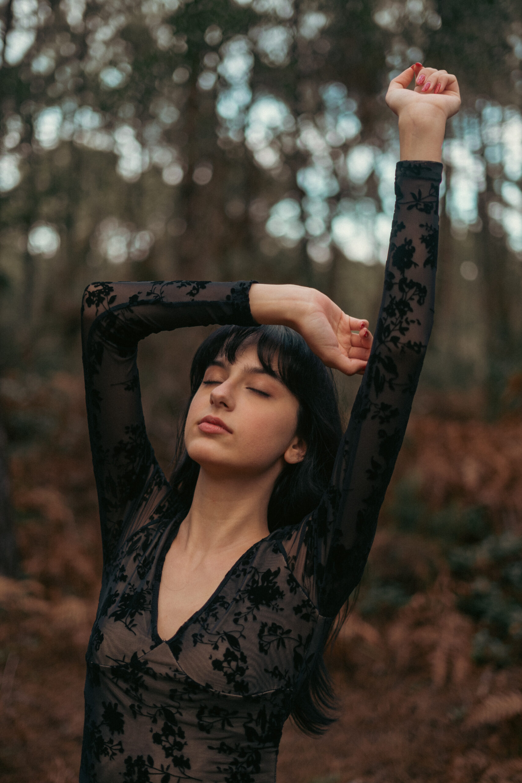 Girl in middle of forest enjoying her freedom